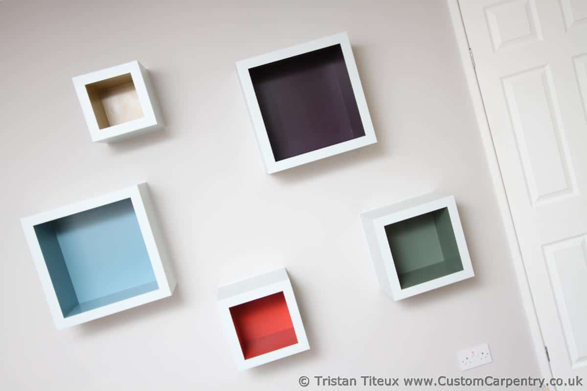 Modern coloured cube shelves on a wall