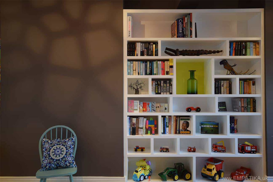 Bespoke white bookshelves with semetrical random compartments