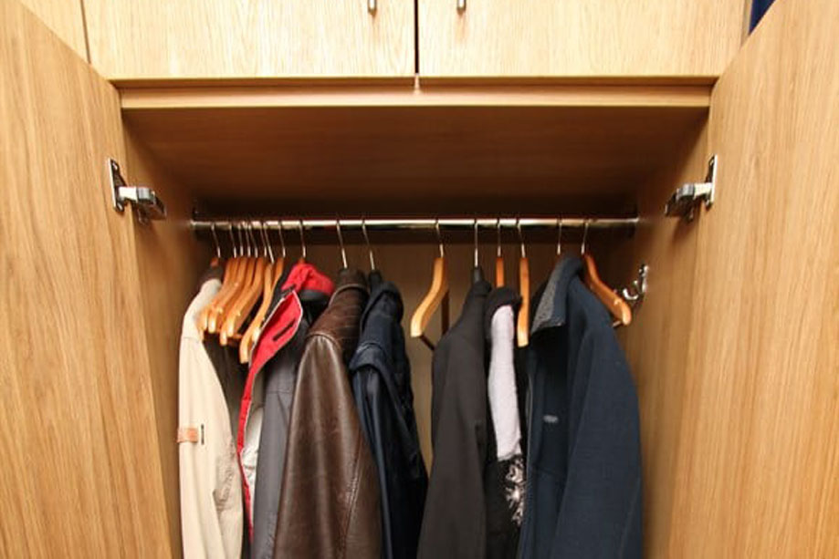 Inside a built in cupboard made of oak veneer