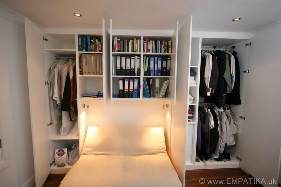 Multi-door alcove wardrobes with spacious storage shelves of varying sizes, clothes rails, and drawers