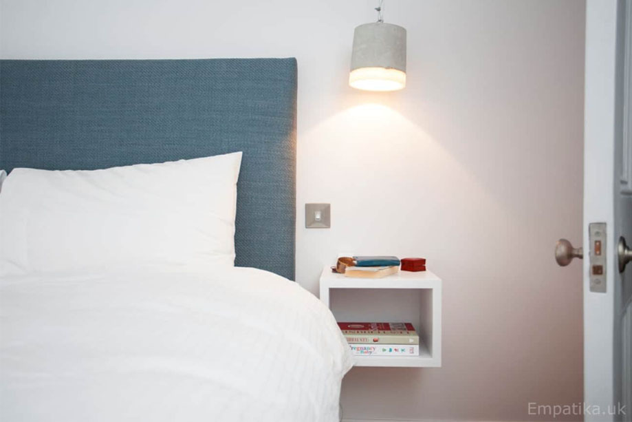 Custom floating box shelf painted White on the bedside