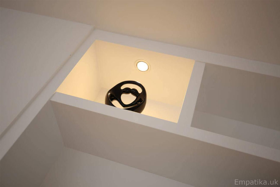 Ceiling high alcove shelves painted White with ambient LED lights