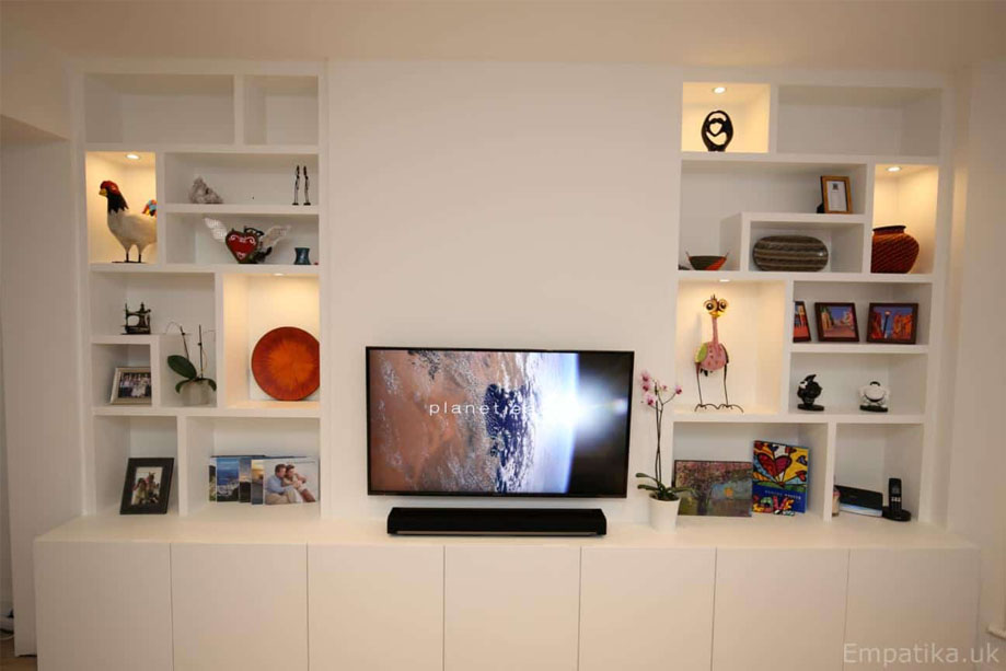Full view of custom display unit with LED light asymmetrical shelves and low media cabinets