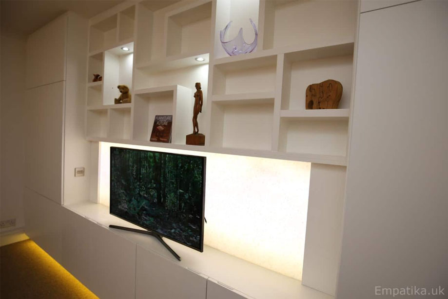 Right side view of eco-fitted TV media unit painted White with furniture underglow