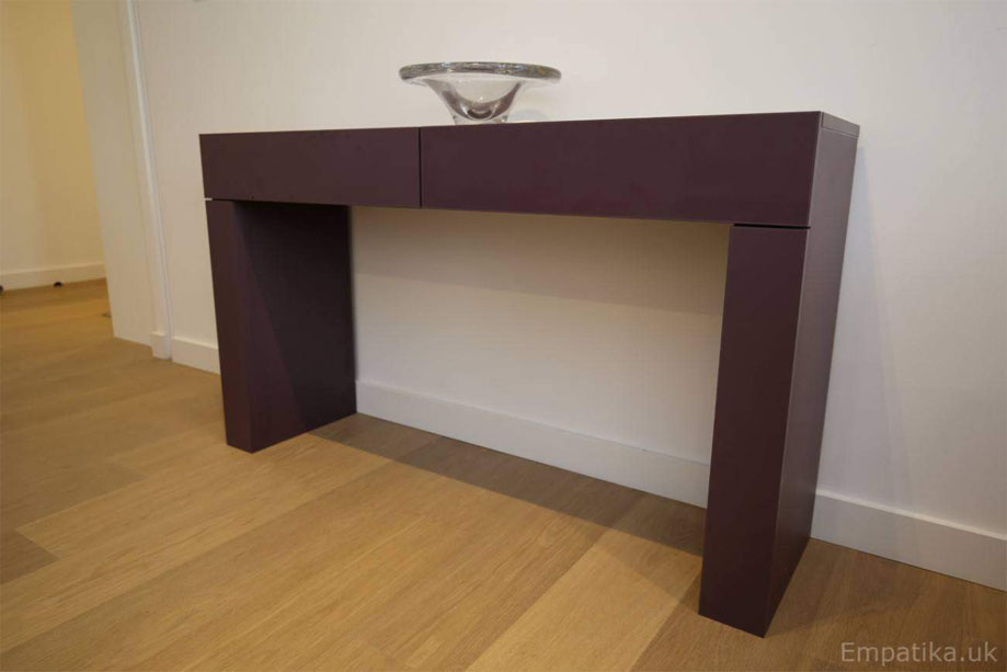 Closer view of bespoke sleek console table with 2 drawers painted Aubergine on a White wall