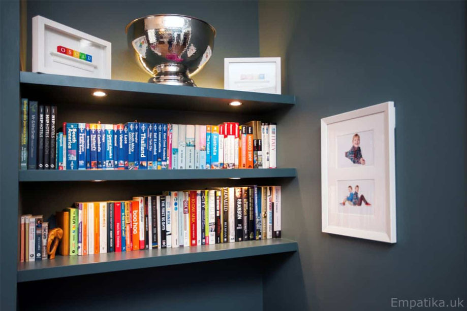 Closer view of fitted alcove shelves with LED lights and a LED strip on the top shelf