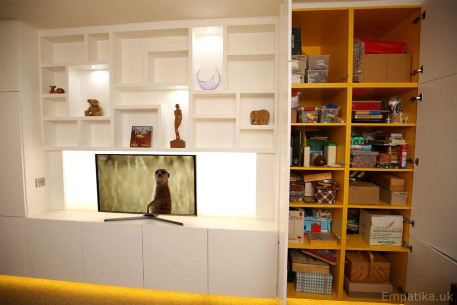 Contemporary living room media unit with asymmetrical shelves, LED pannel TV stand, and closets on the side and bottom
