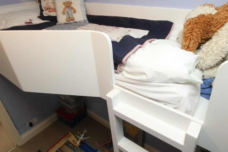 Loft bed with play area underneath inside children's bedroom