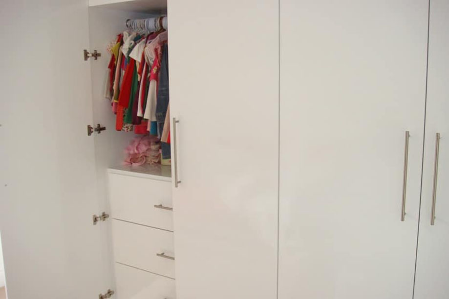 Tall White painted children's bedroom wardrobes with clothes rack and drawers inside