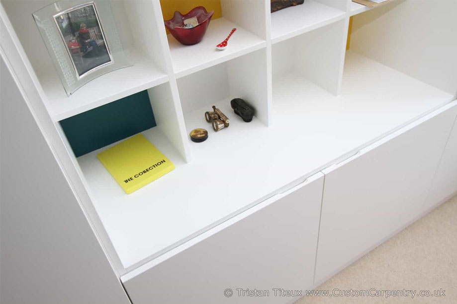Closer view of custom cupboards bottom closets with edge pocket on doors for easy opening