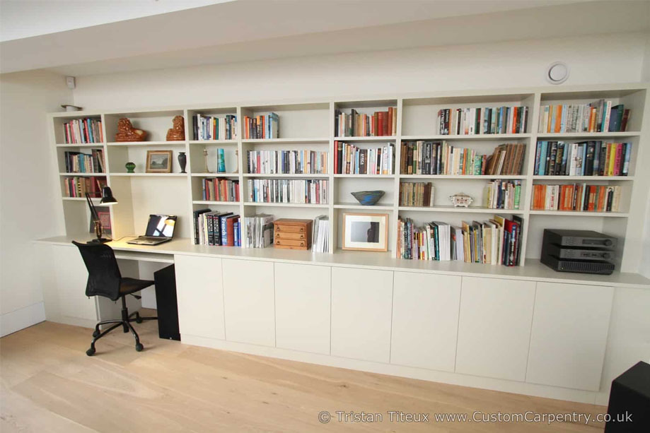 Bespoke built in home office library bookcase with corner computer desk and pull-out keyboard tray