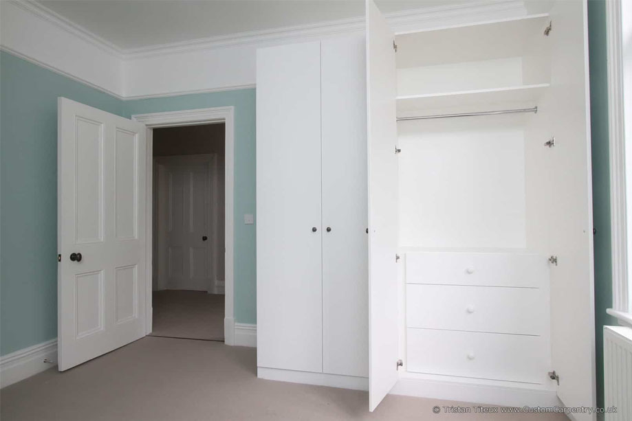 Tall White painted bedroom eco wardrobes with 4 slim doors and various storage spaces inside