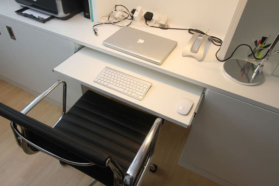 White painted bookcase with pull-out computer desk and table top with access to electrics