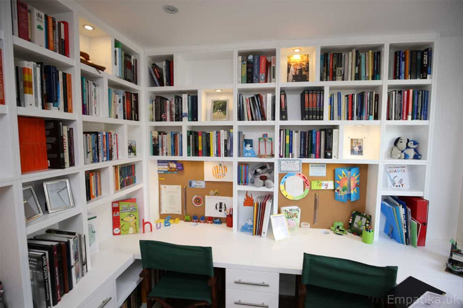 Fitted White painted home office furniture with library bookcase and desks with bottom drawers built on two walls