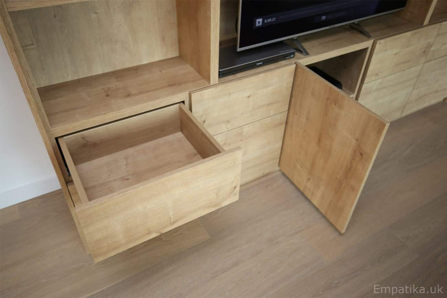 Closer view of bespoke storage unit with drawers and bottom cupboards